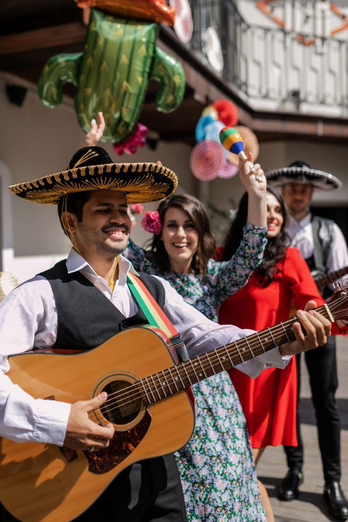 Lively Cinco de Mayo celebration with musicians and traditional attire, showcasing vibrant cultural expressions.